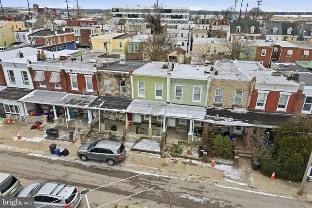 an aerial view of residential houses with outdoor space