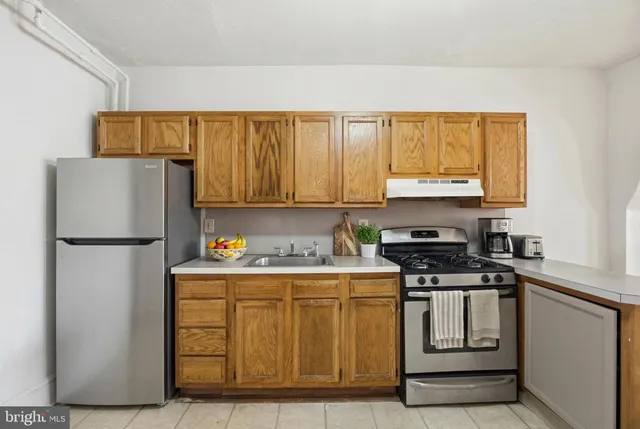a kitchen with a stove and a sink