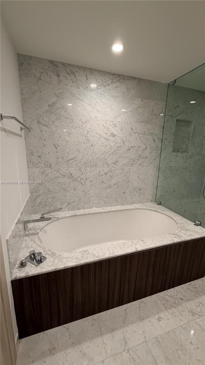 1000 Brickell, Unit 2014 Miami, FL 33131 - Photo 25 of 30 a bathroom with a bathtub