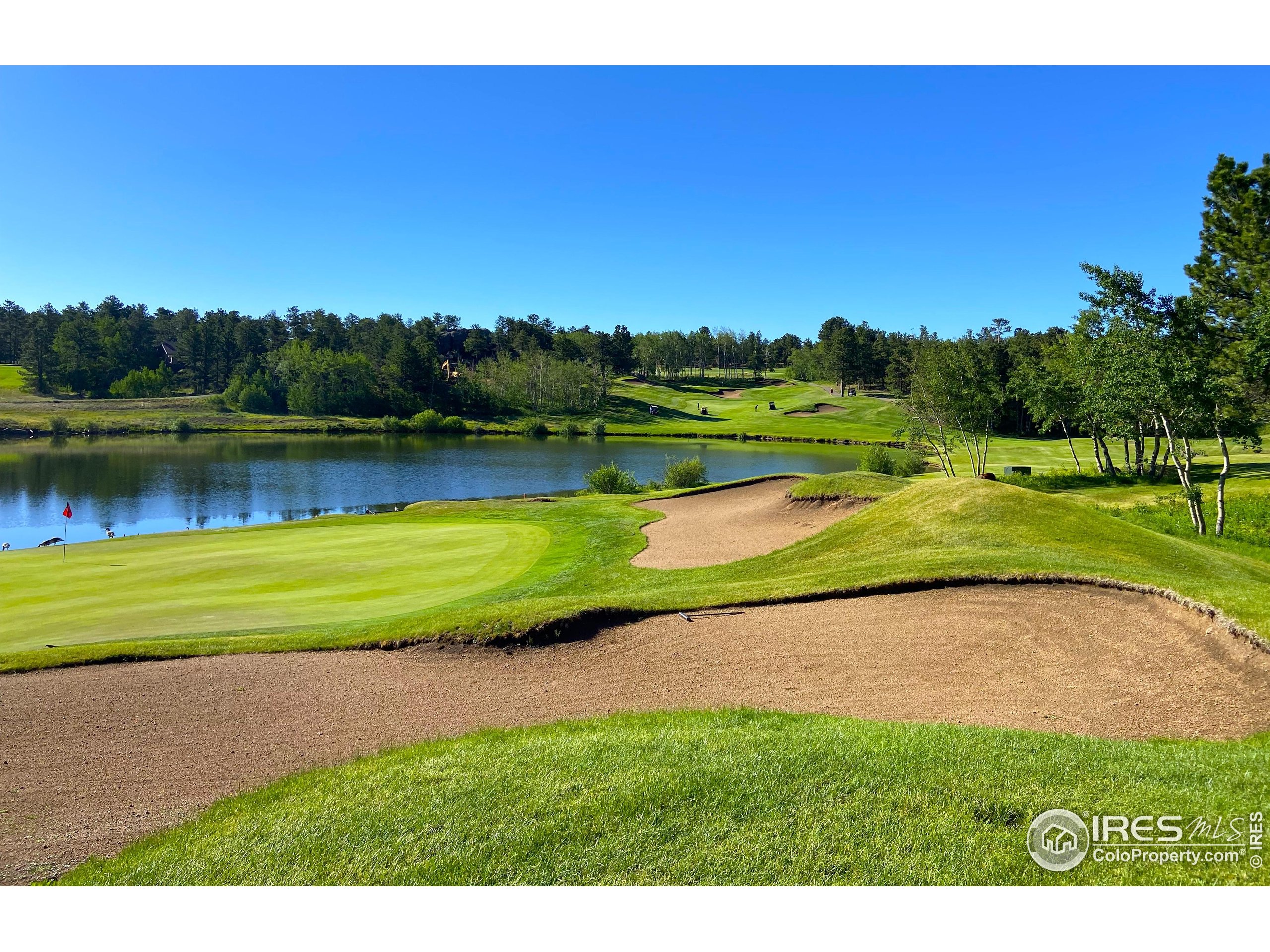 3 Fox Meadow Lane, Unit LOT 3 Red Feather Lakes, CO 80545 - Photo 14 of 25 a view of a lake with a yard