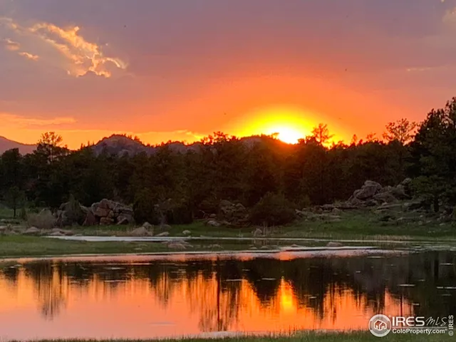 a view of an ocean and mountains