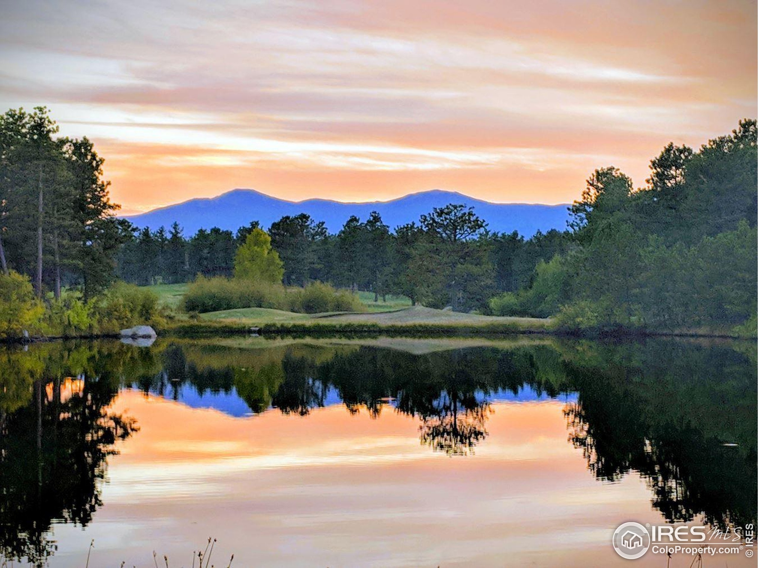 3 Fox Meadow Lane, Unit LOT 3 Red Feather Lakes, CO 80545 - Photo 20 of 25 a view of a lake with a mountain
