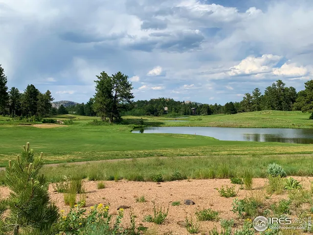 a view of a golf course with a big yard