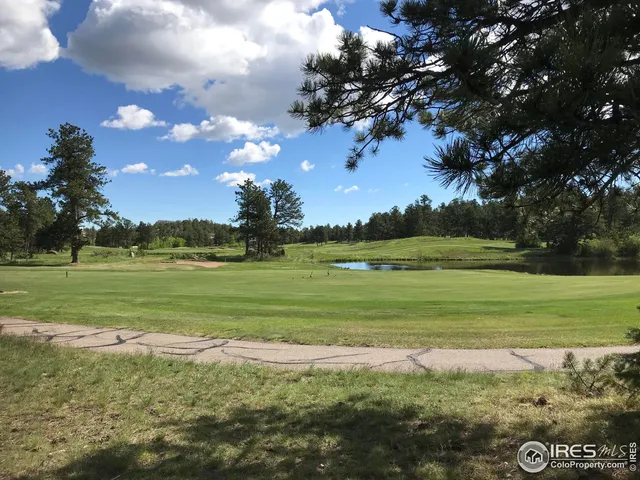 a view of a golf course with a lake
