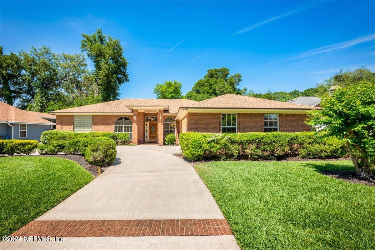 10967 Heathfield Road Jacksonville, FL 32225 - Photo 1 of 39 a front view of a house with a yard