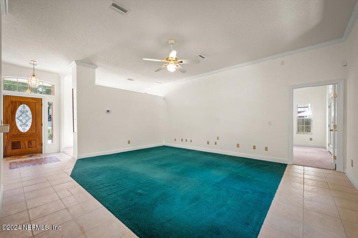 10967 Heathfield Road Jacksonville, FL 32225 - Photo 11 of 39 a view of a entrance door with yellow lighting