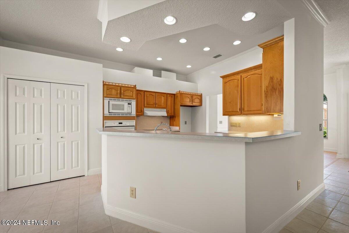 10967 Heathfield Road Jacksonville, FL 32225 - Photo 16 of 39 a view of kitchen with stainless steel appliances granite countertop cabinets and a window