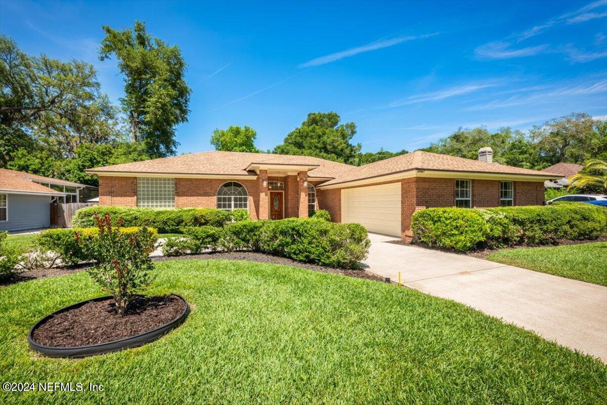 10967 Heathfield Road Jacksonville, FL 32225 - Photo 2 of 39 a view of a patio with a yard