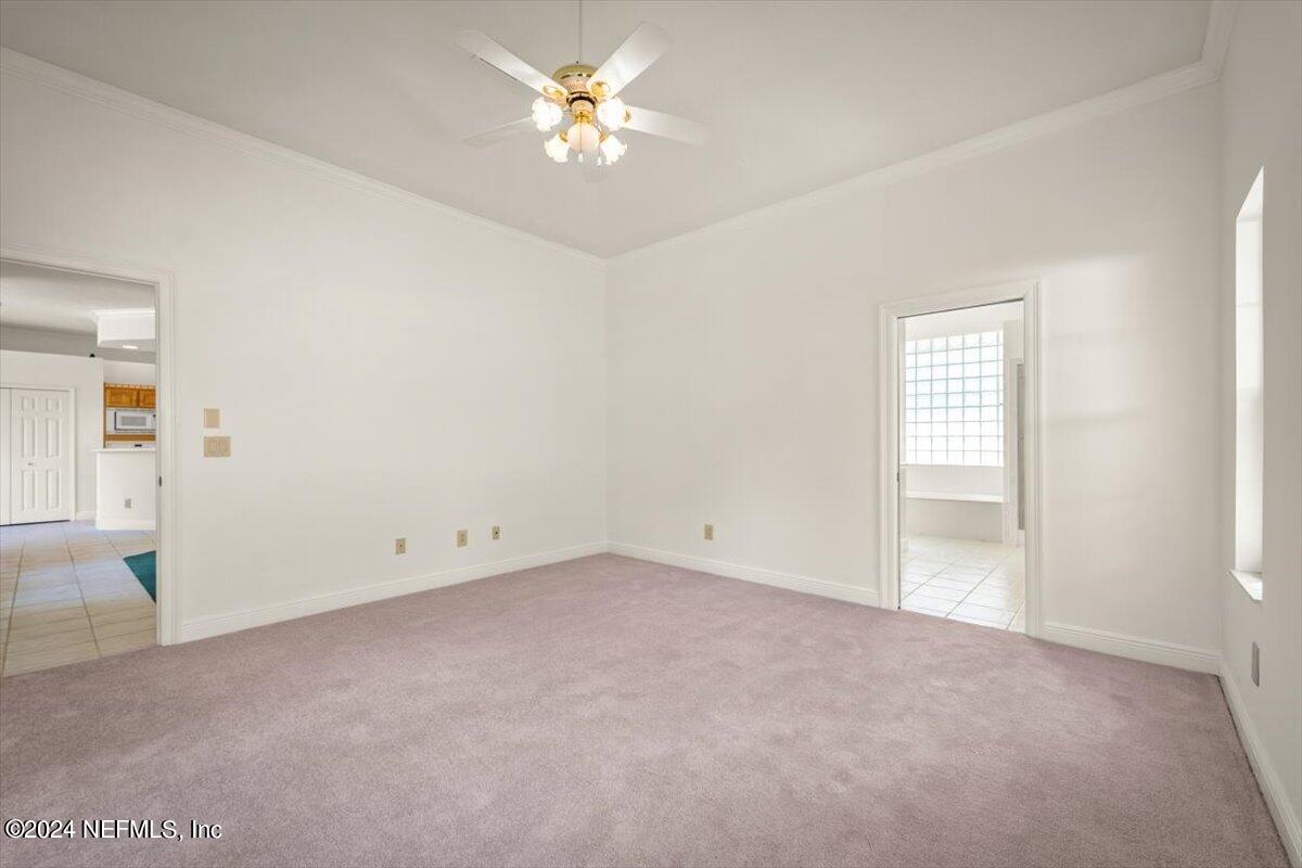 10967 Heathfield Road Jacksonville, FL 32225 - Photo 33 of 39 an empty room with a view of a bedroom