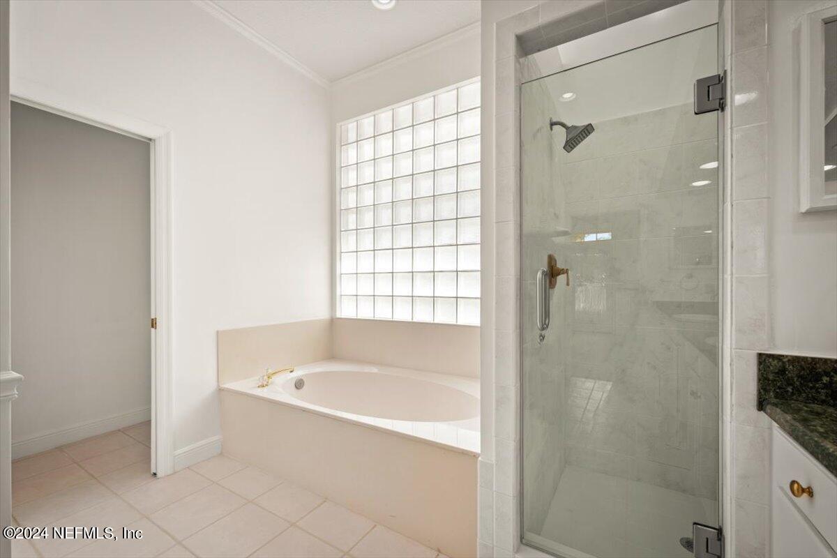 10967 Heathfield Road Jacksonville, FL 32225 - Photo 35 of 39 a bathroom with a bathtub and shower