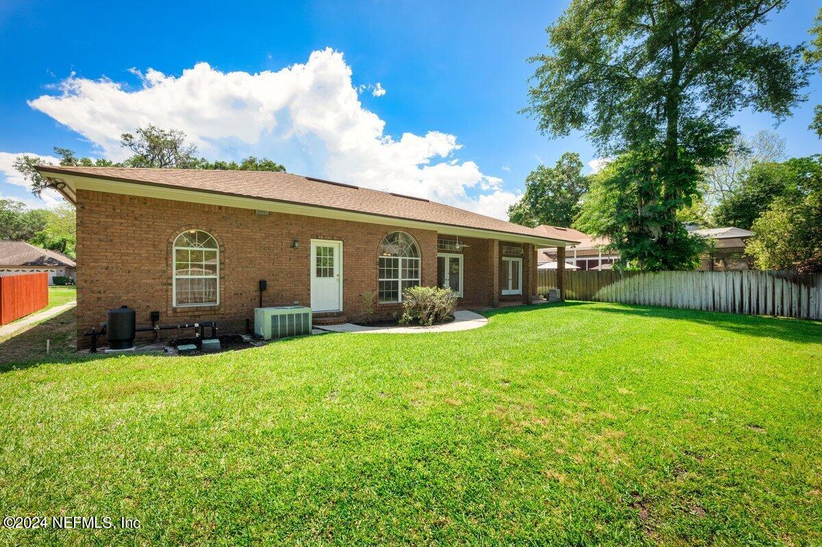 10967 Heathfield Road Jacksonville, FL 32225 - Photo 36 of 39 front view of a house with a yard