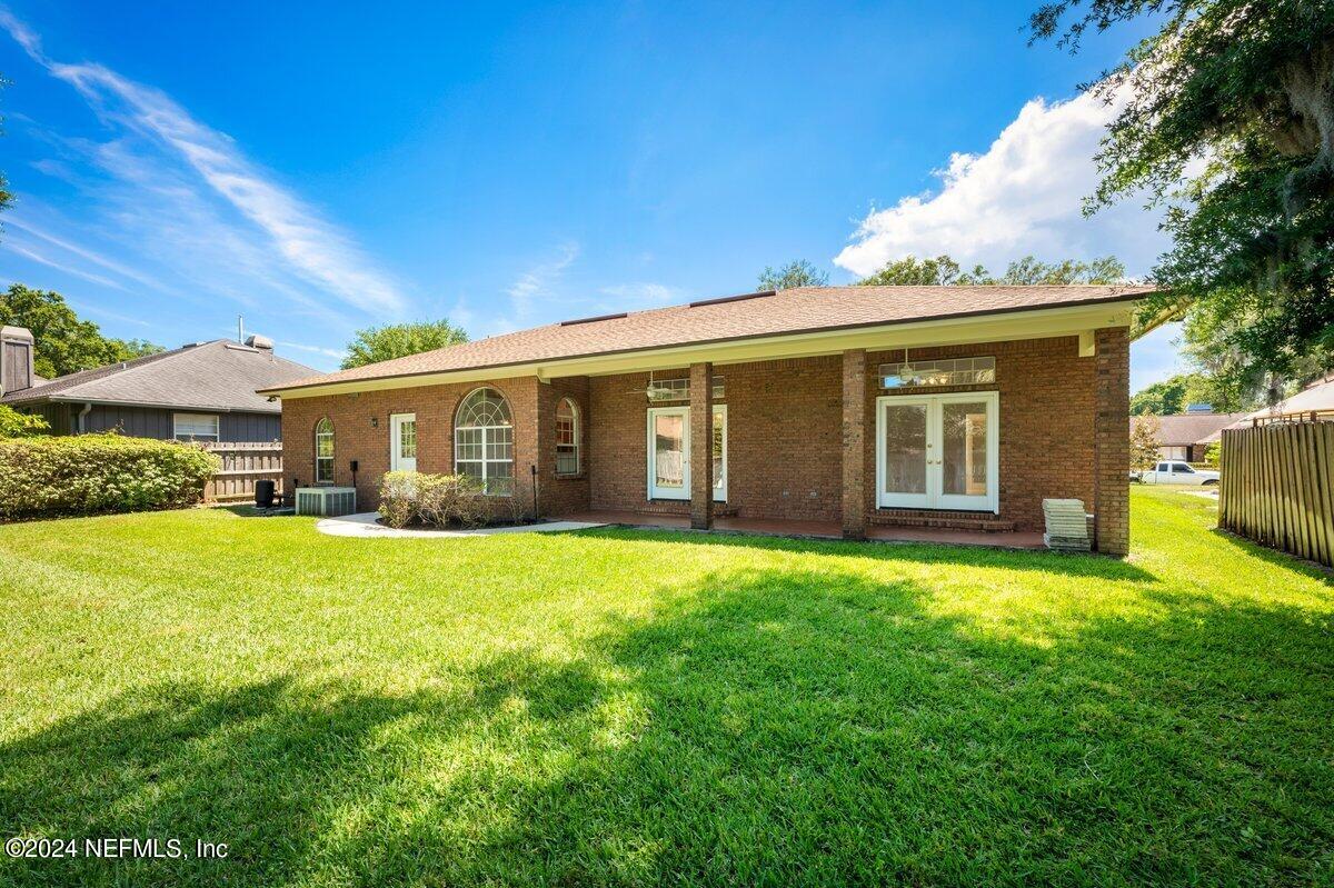 10967 Heathfield Road Jacksonville, FL 32225 - Photo 37 of 39 a front view of a house with a garden