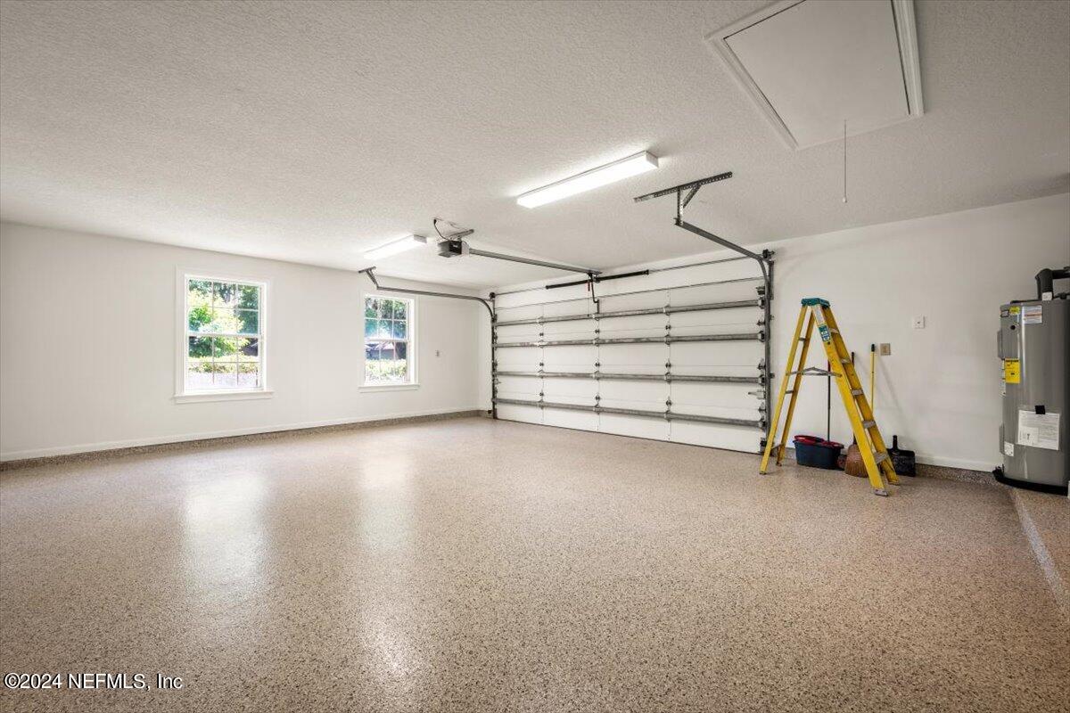 10967 Heathfield Road Jacksonville, FL 32225 - Photo 39 of 39 a view of a room with gym equipment and a window