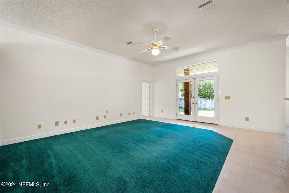 10967 Heathfield Road Jacksonville, FL 32225 - Photo 10 of 39 an empty room with window