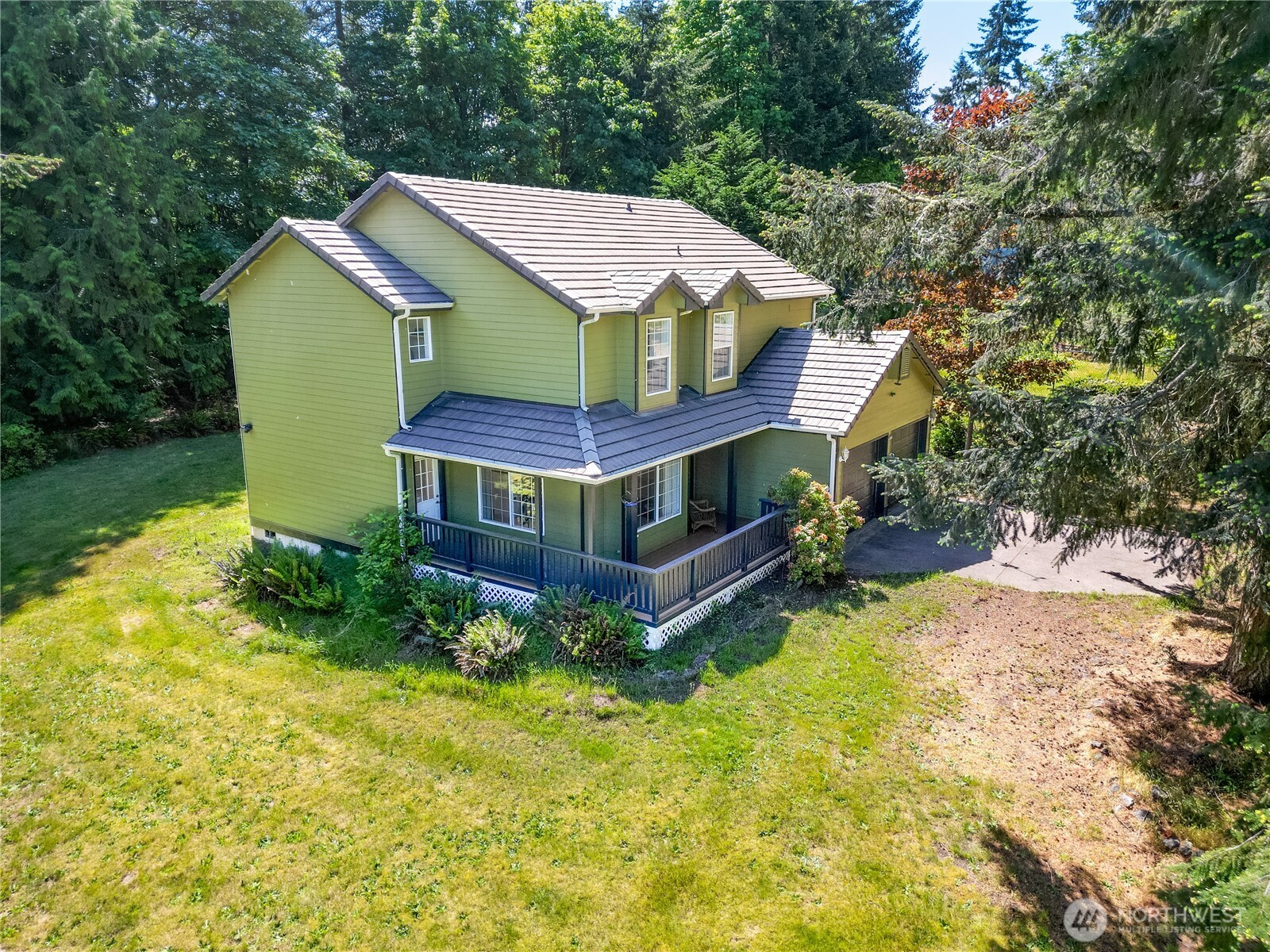 301 Mt Pleasant Estates Road Port Angeles, WA 98362 - Photo 29 of 40 a aerial view of a house with a yard and large trees