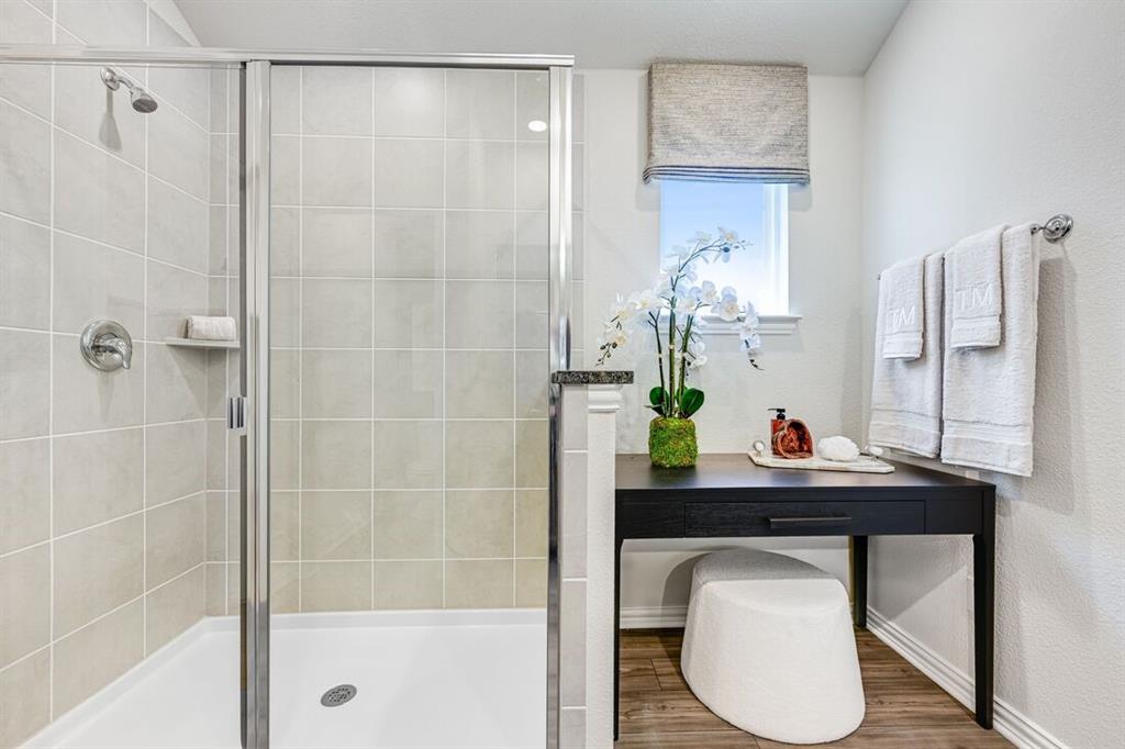 2621 Glacier Road Anna, TX 75409 - Photo 5 of 38 a bathroom with a sink toilet and shower