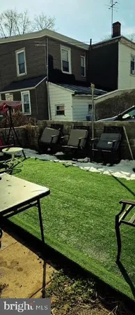 a view of swimming pool with an outdoor seating