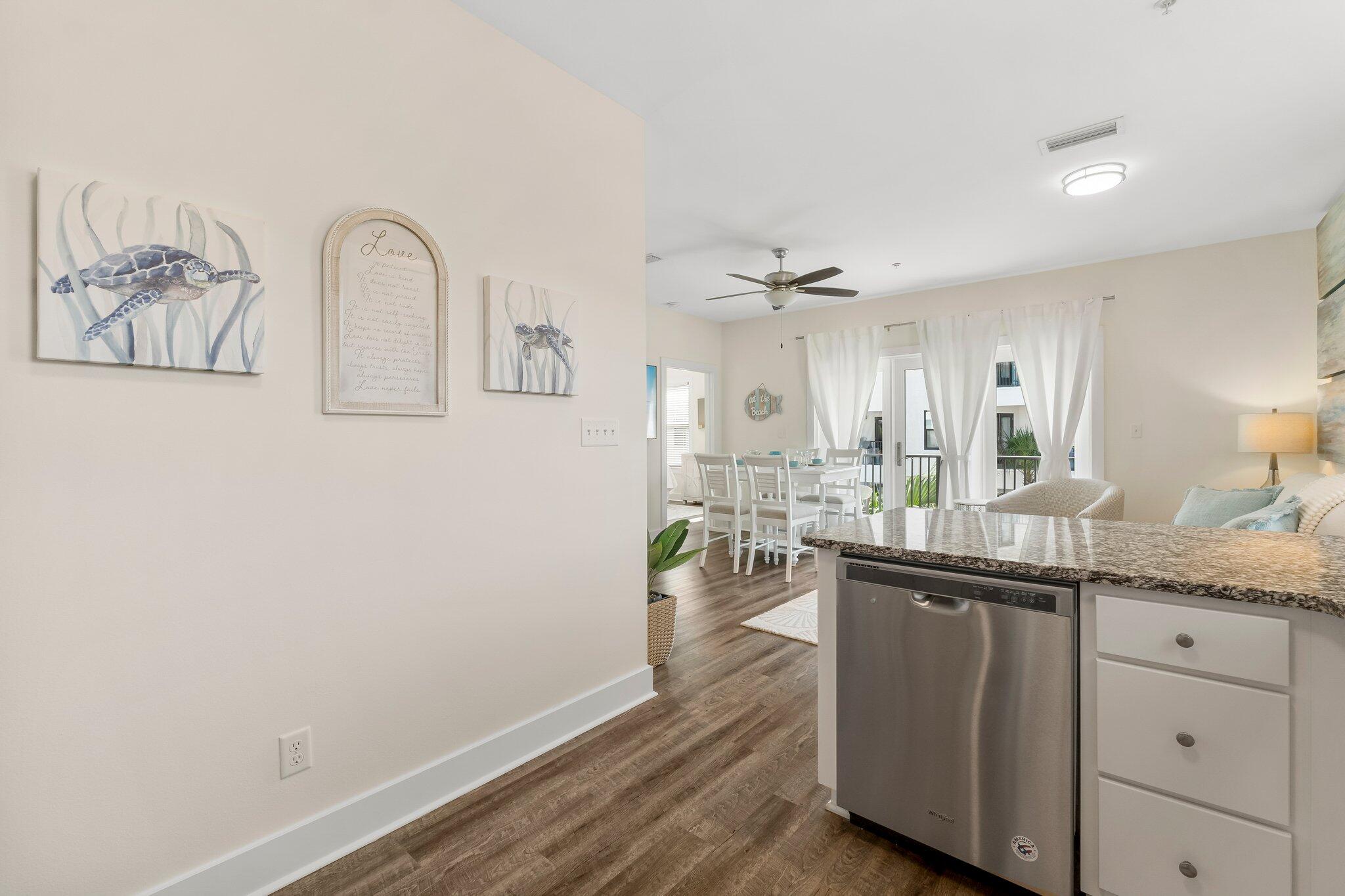 3958 West County Highway 30A, Unit 124 Santa Rosa Beach, FL 32459 - Photo 16 of 51 a kitchen with a sink cabinets and wooden floor