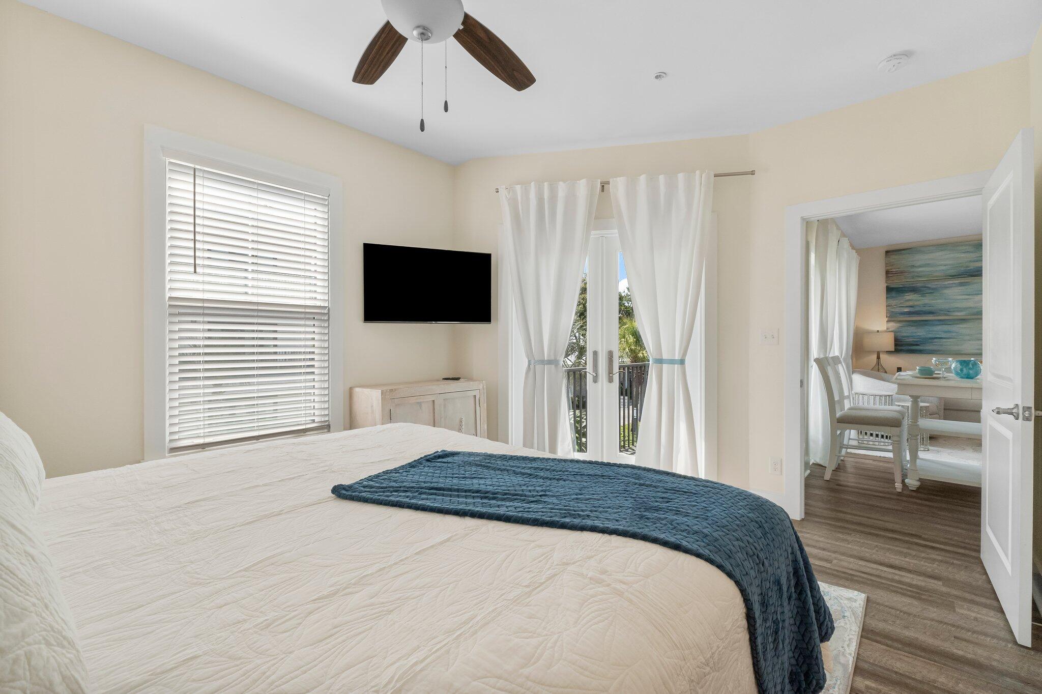 3958 West County Highway 30A, Unit 124 Santa Rosa Beach, FL 32459 - Photo 22 of 51 a bedroom with a bed and a flat screen tv
