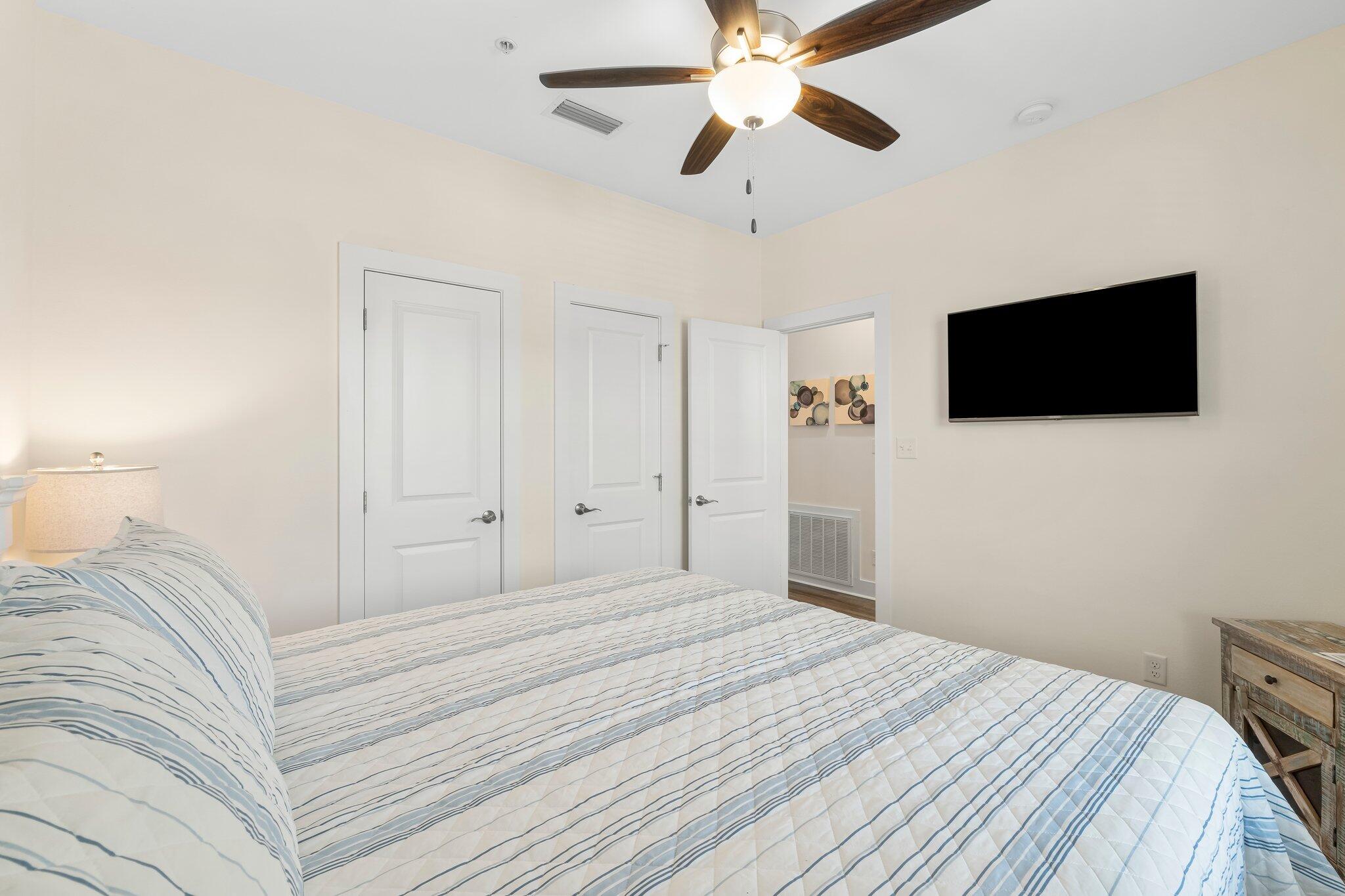 3958 West County Highway 30A, Unit 124 Santa Rosa Beach, FL 32459 - Photo 27 of 51 a bedroom with a bed and a flat screen tv