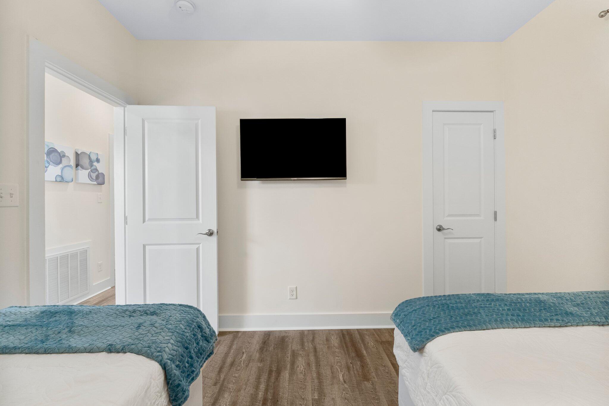 3958 West County Highway 30A, Unit 124 Santa Rosa Beach, FL 32459 - Photo 30 of 51 a bedroom with a bed and a flat screen tv