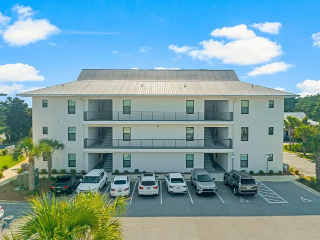 an aerial view of house with yard
