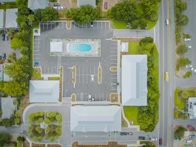 an aerial view of residential houses with outdoor space