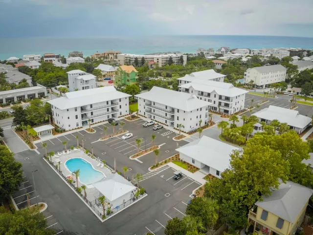 swimming pool view with a seating space