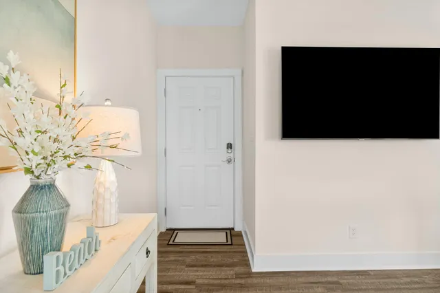 a living room with furniture and kitchen view