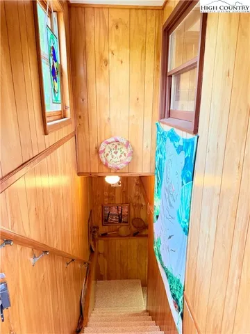 a view of a green field with an trees in the background
