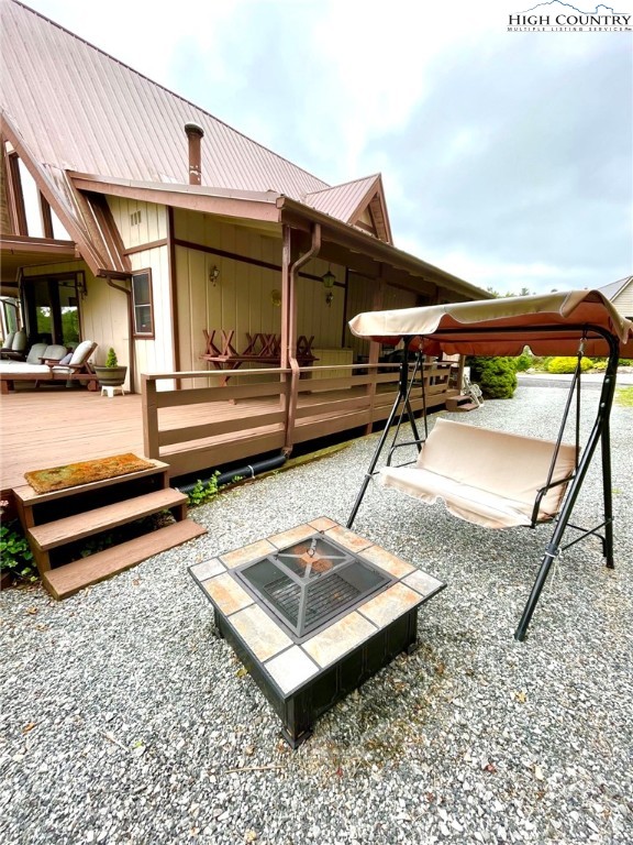 118 Pine Ridge Loop Newland, NC 28657 - Photo 47 of 50 a view of a patio with a table and chairs
