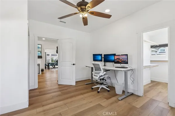 a view of a workspace with furniture and a workspace