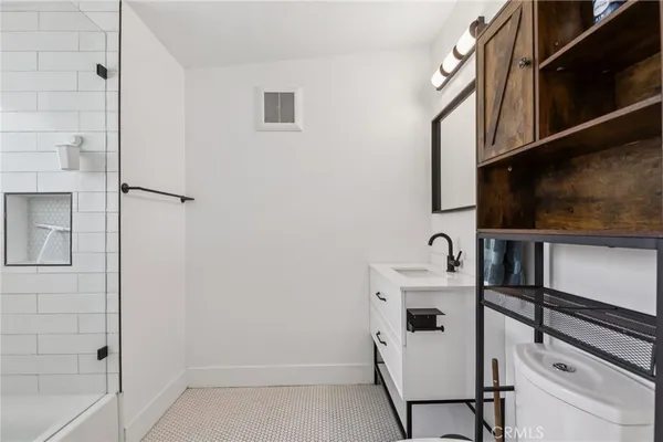a bathroom with a sink a mirror and window