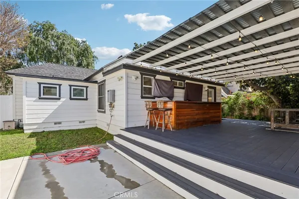 a view of a backyard with sitting area