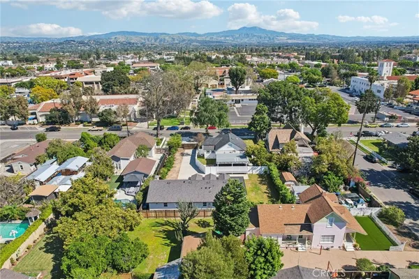 an aerial view of residential houses with outdoor space
