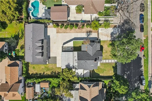 an aerial view of a house with a garden and yard
