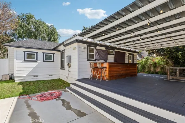 a view of a backyard with sitting area