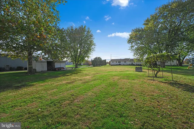 a view of a room with a big yard
