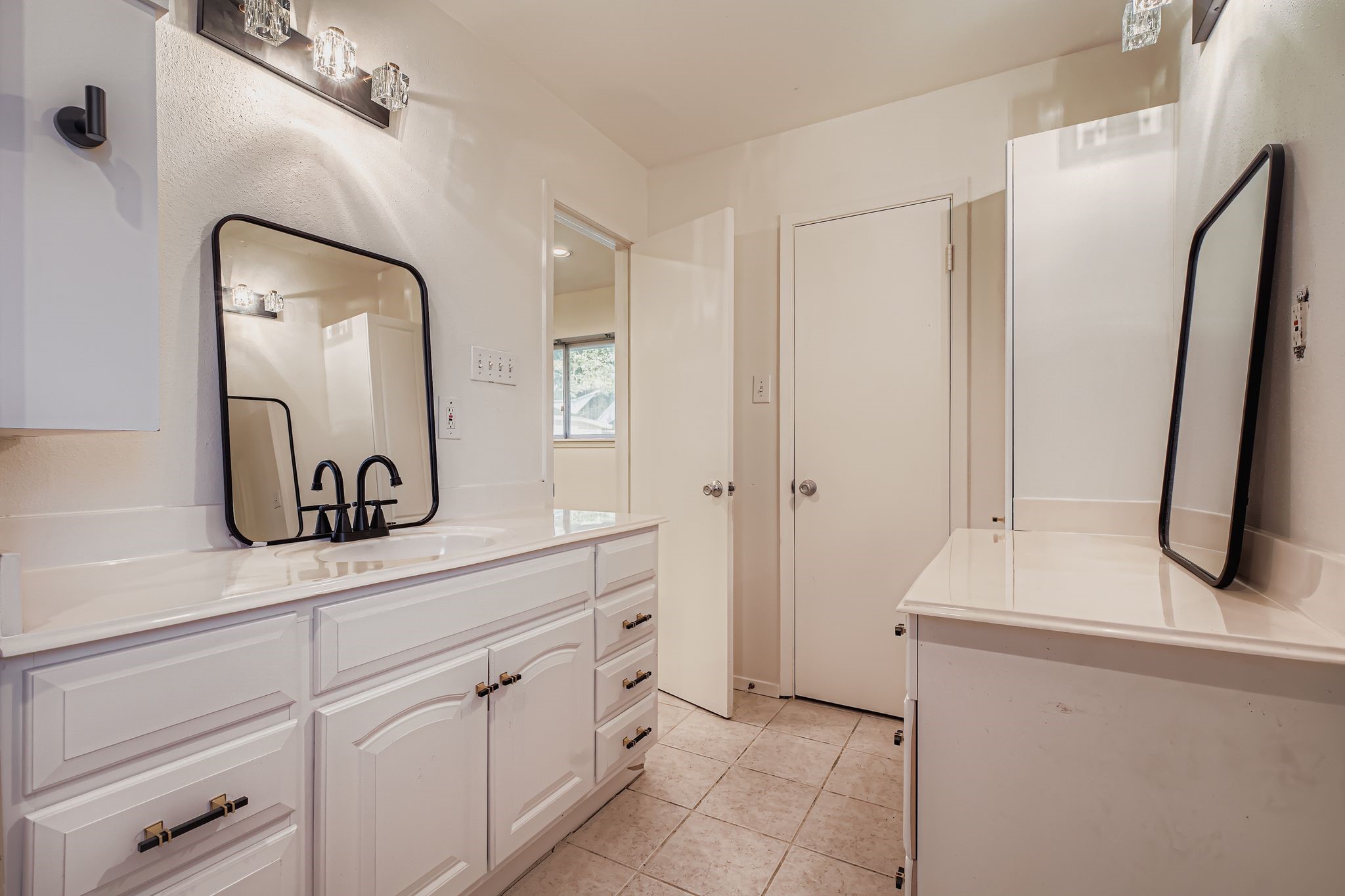 1411 Neptune Lane Houston, TX 77062 - Photo 15 of 22 a bathroom with a sink and a mirror