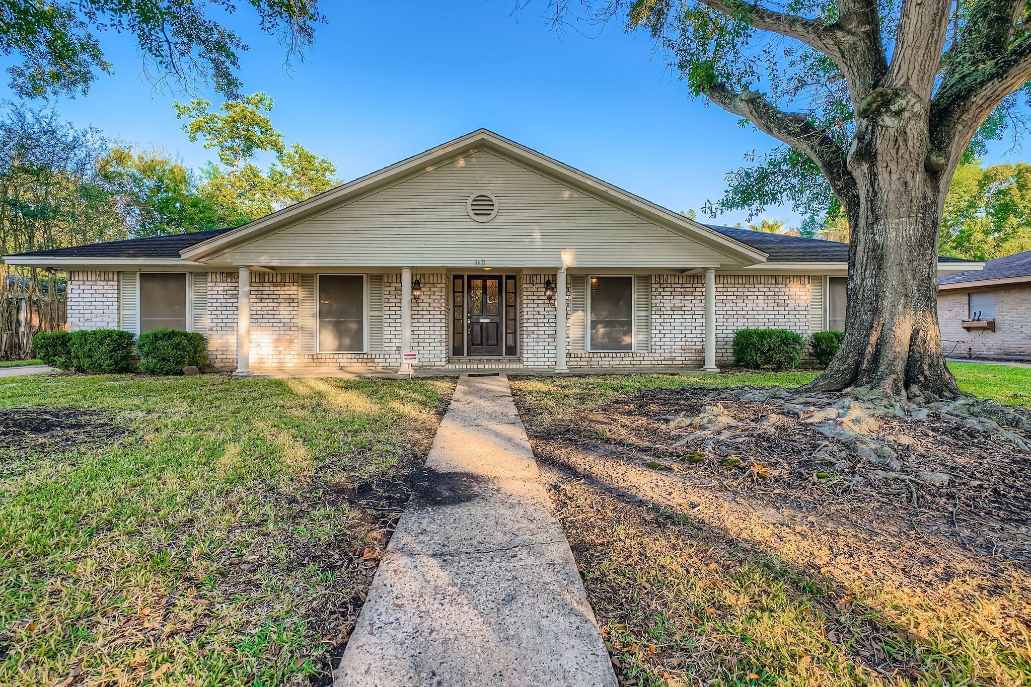1411 Neptune Lane Houston, TX 77062 - Photo 2 of 22 a front view of house with yard and green space