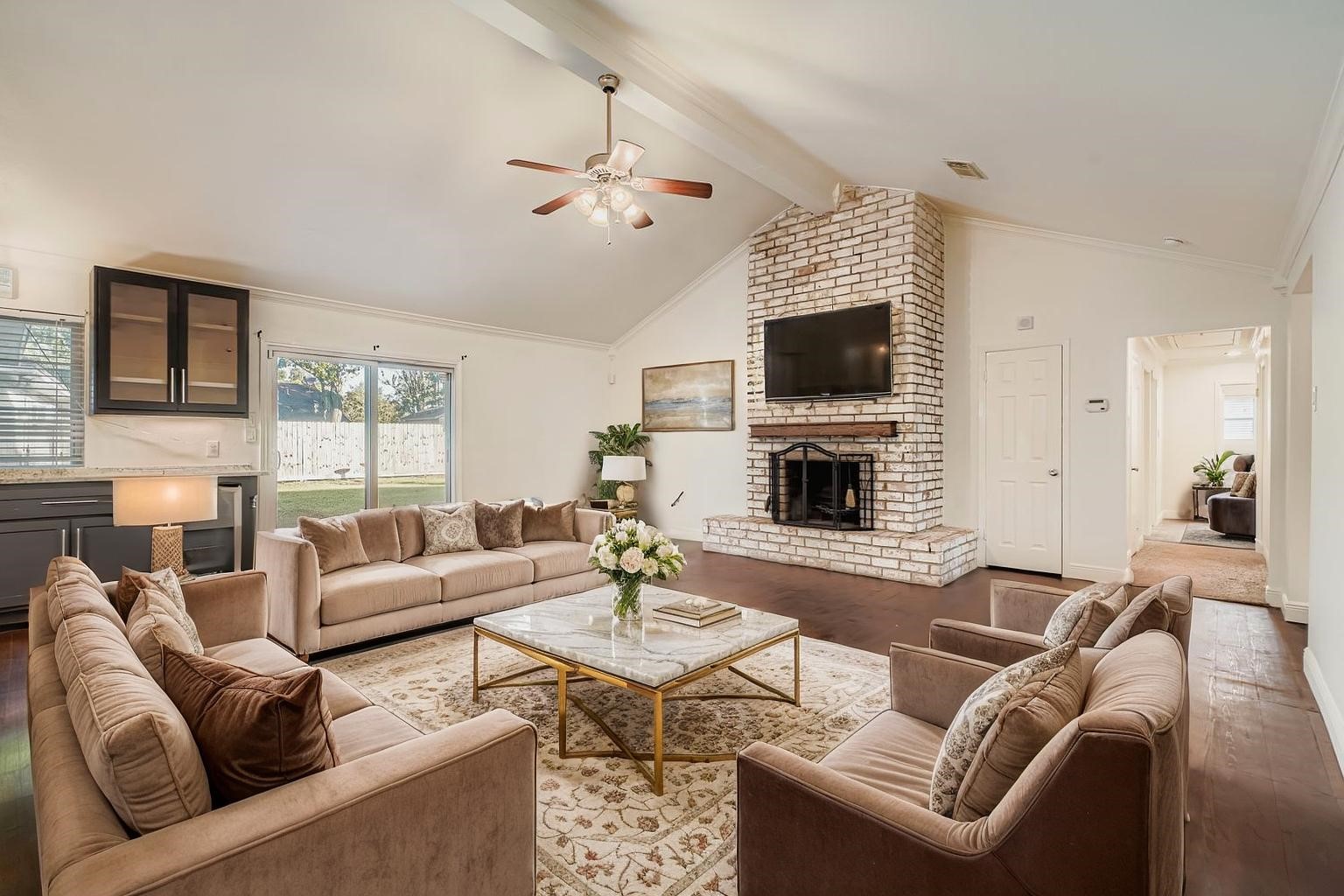 1411 Neptune Lane Houston, TX 77062 - Photo 7 of 22 a living room with furniture a flat screen tv and a fireplace
