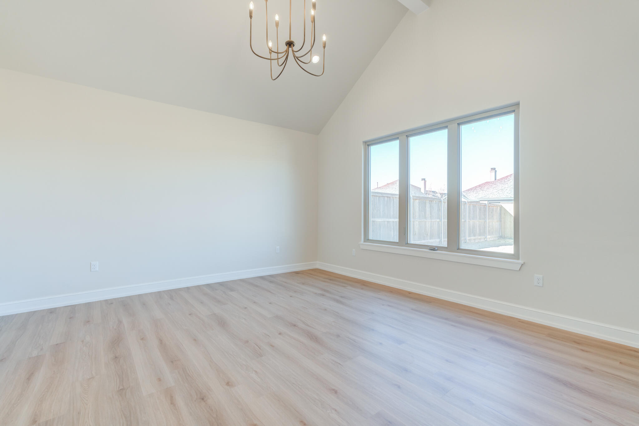 4602 140th Street Lubbock, TX 79424 - Photo 29 of 56 a view of empty room with wooden floor and fan