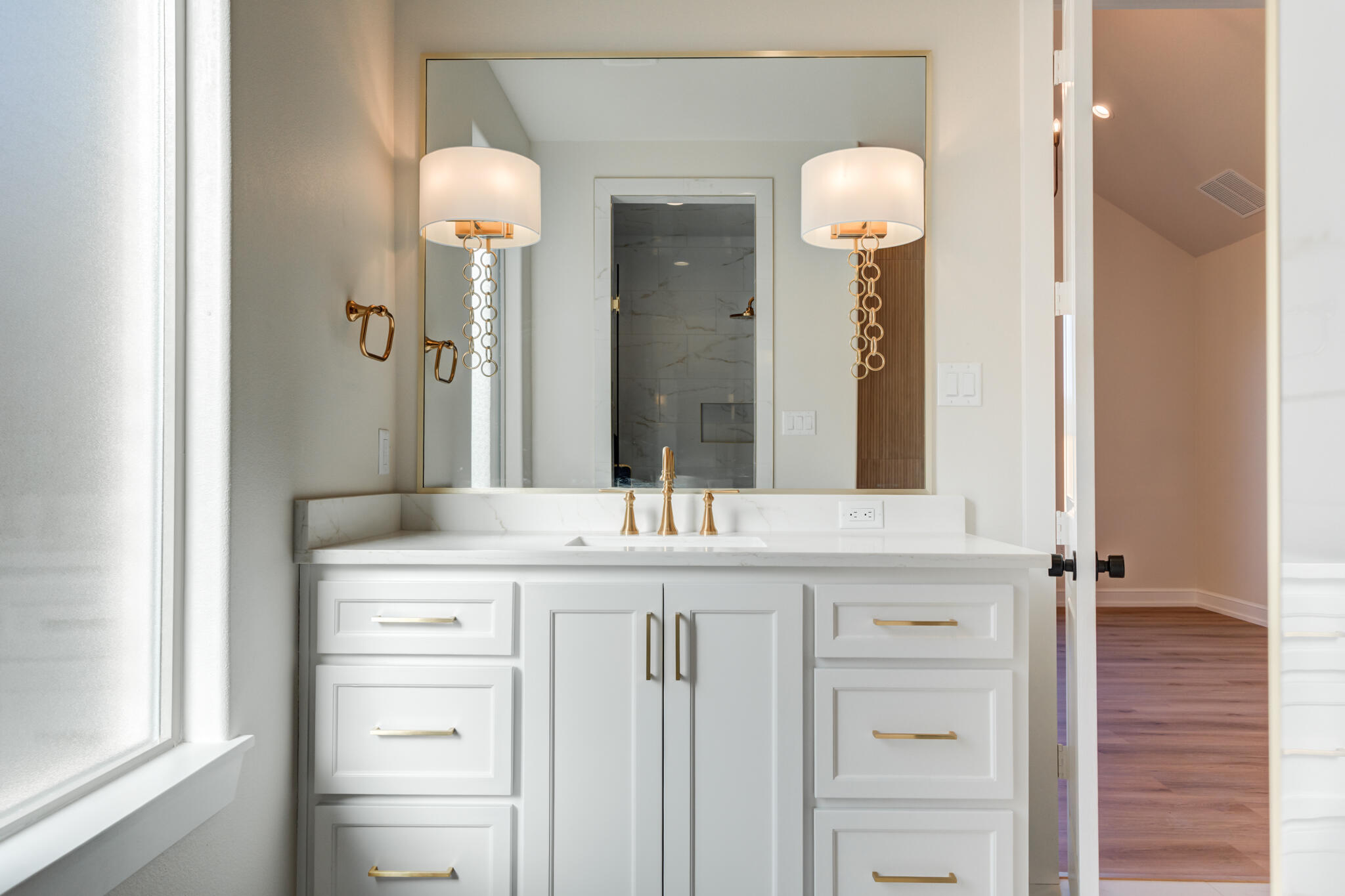 4602 140th Street Lubbock, TX 79424 - Photo 34 of 56 a bathroom with a granite countertop sink and a mirror
