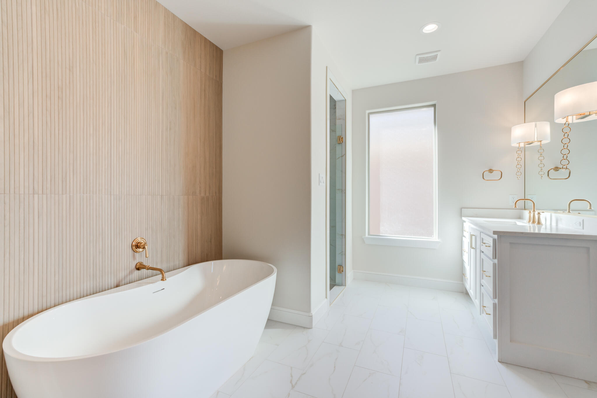 4602 140th Street Lubbock, TX 79424 - Photo 36 of 56 a bathroom with a tub sink and mirror