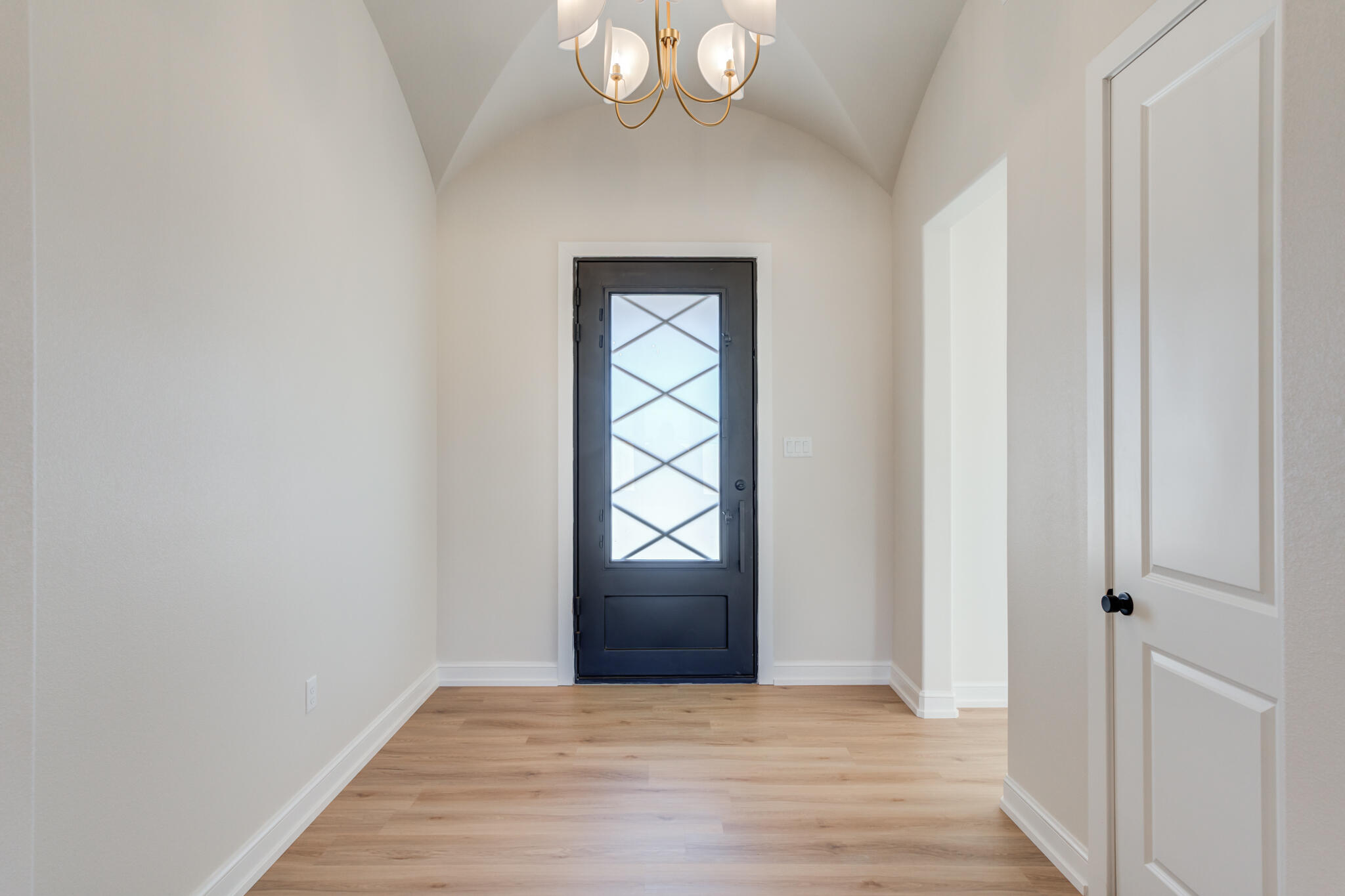 4602 140th Street Lubbock, TX 79424 - Photo 5 of 56 an empty room with wooden floor cabinet and window