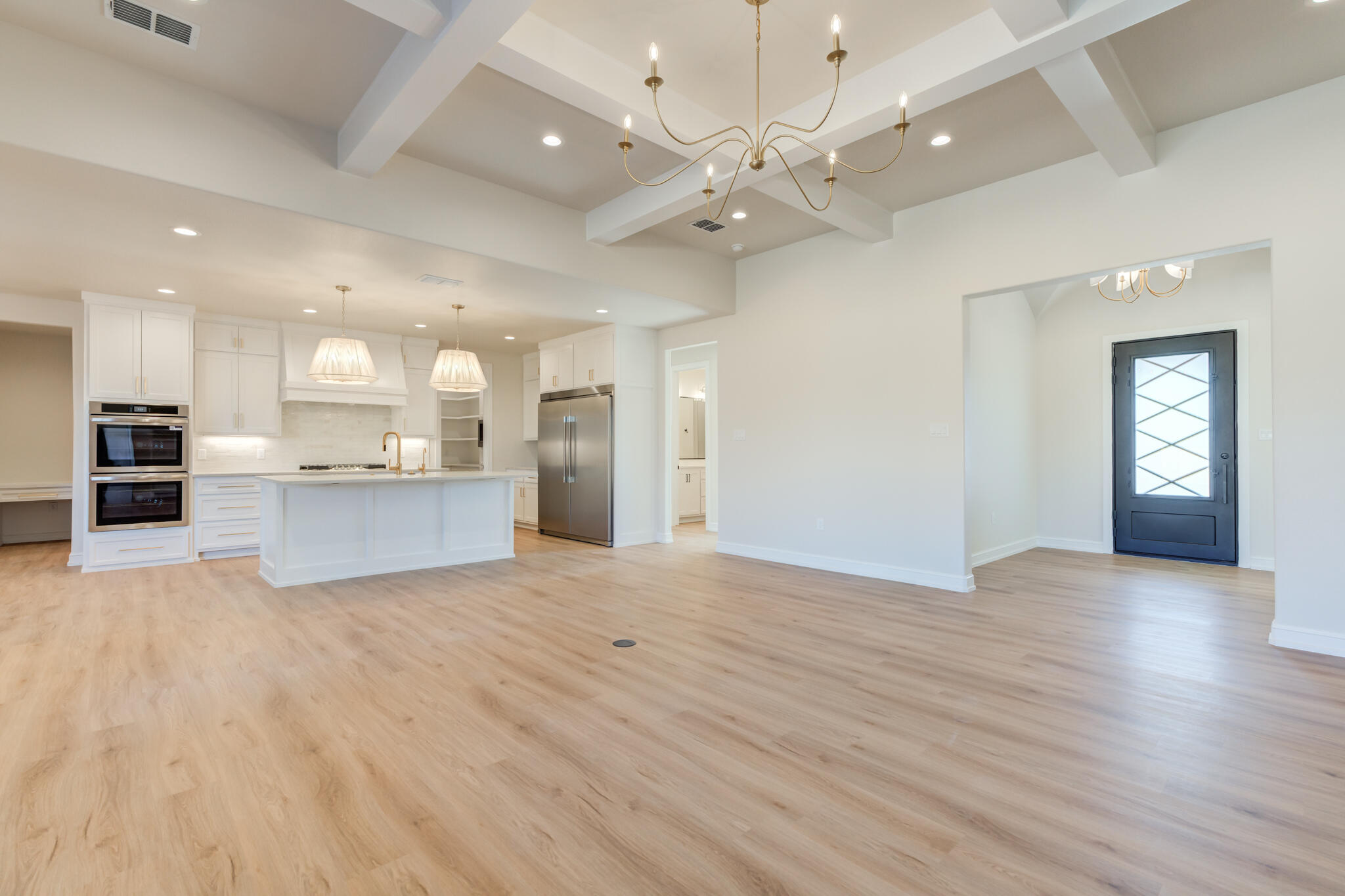 4602 140th Street Lubbock, TX 79424 - Photo 10 of 56 an open kitchen with a refrigerator and a sink