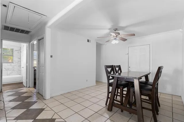 a view of a dining room that has a table and chairs