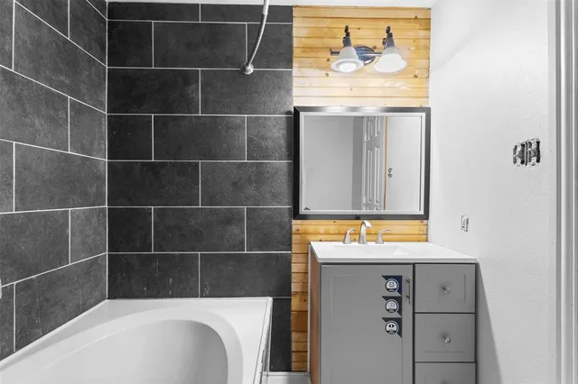 a view of bathroom with a sink and a window
