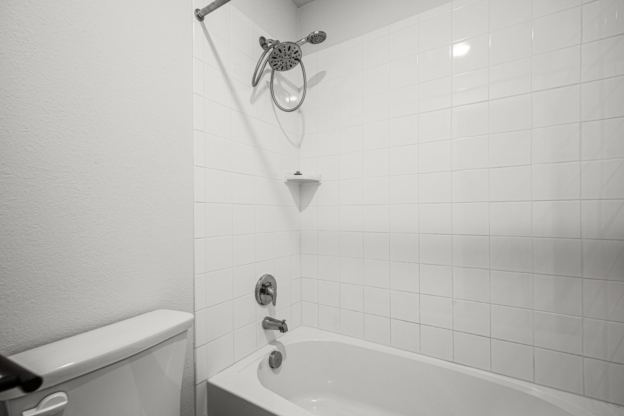 841 Spinnaker Loop Kyle, TX 78640 - Photo 35 of 40 Bathroom with shower / bath combination and a textured wall