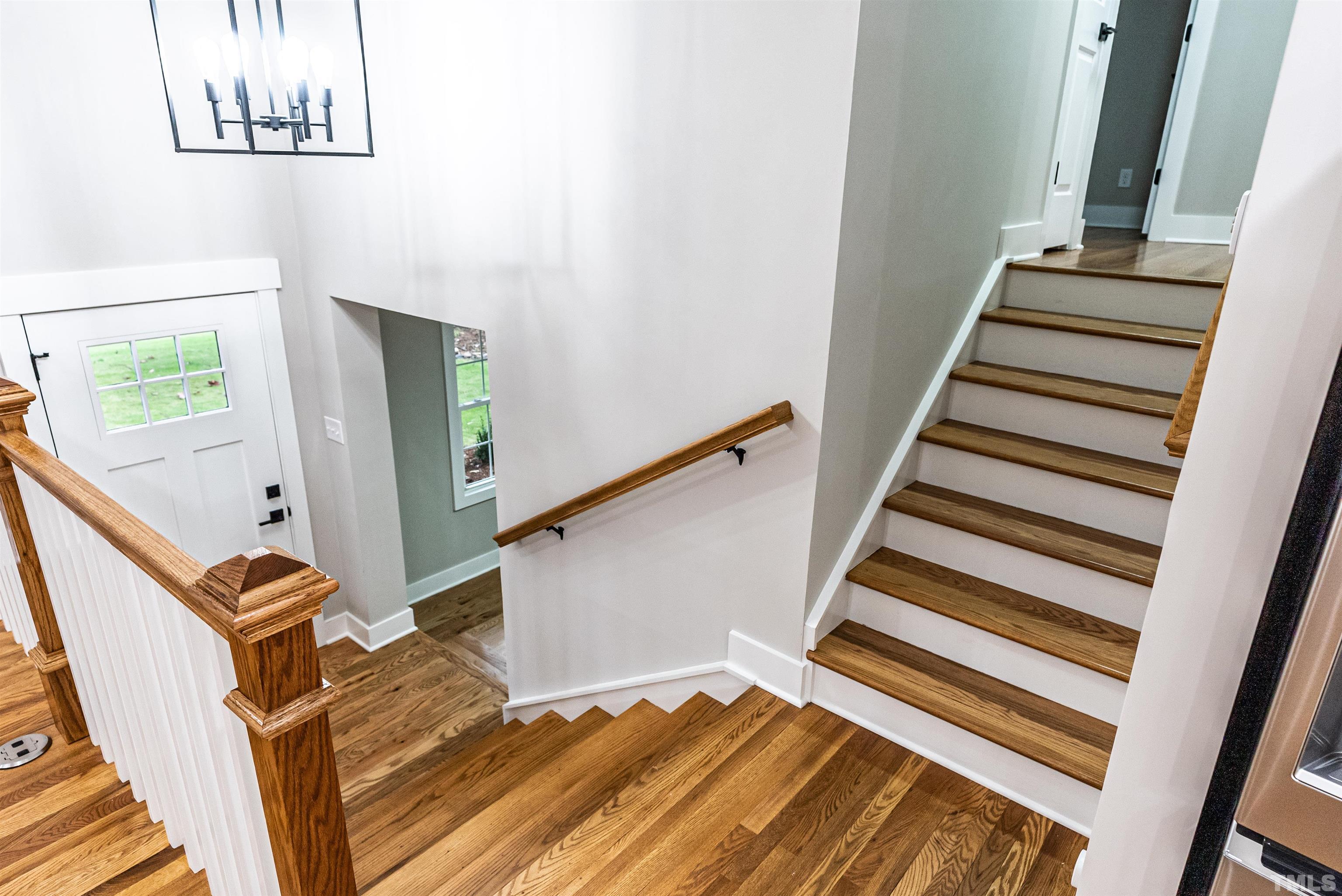 5405 Emerson Drive Raleigh, NC 27609 - Photo 18 of 46 a view of a room with stairs and a window